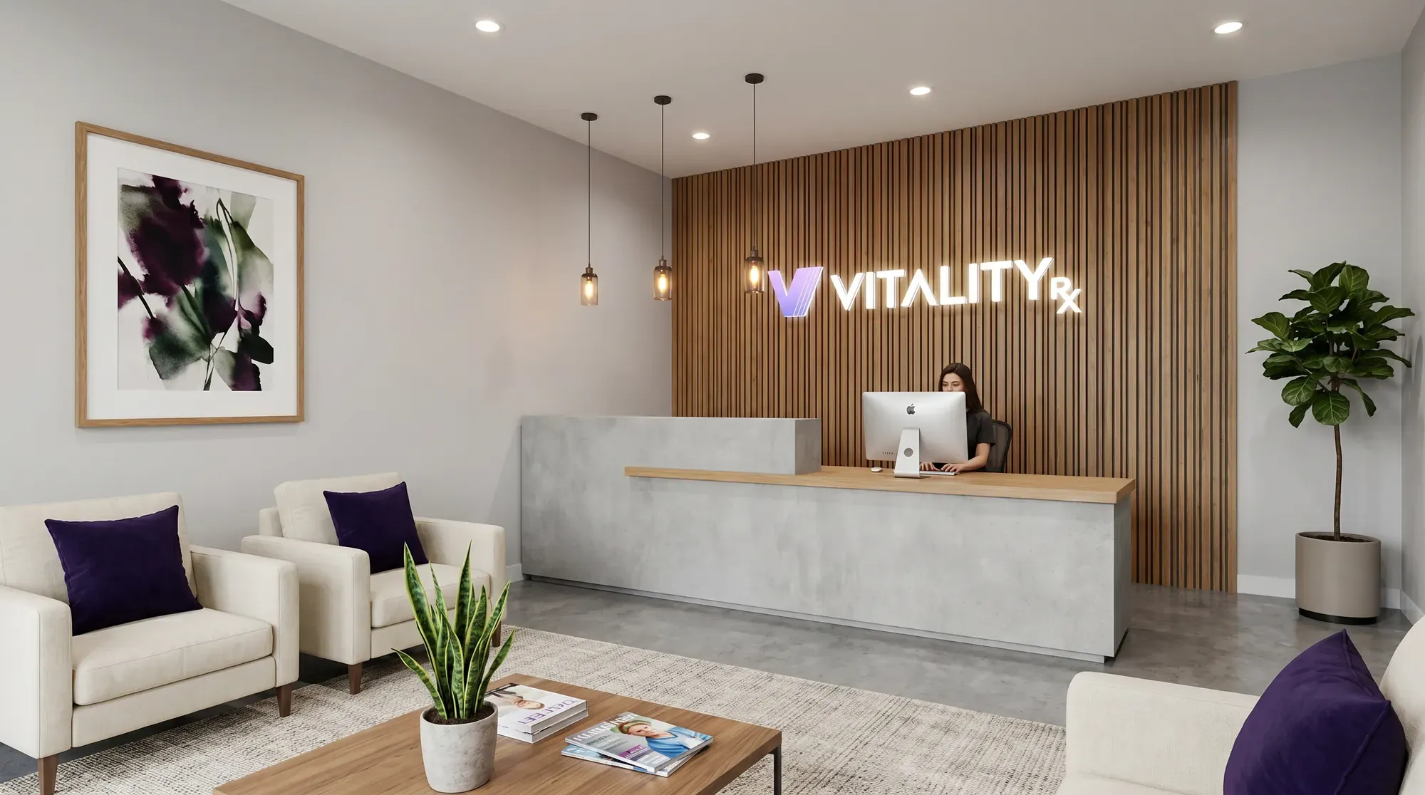 A reception area with a staffed front desk and VitalityRx signage.